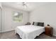 This bedroom offers a ceiling fan, neutral walls, and closet with mirrored doors at 2312 W Temple St, Chandler, AZ 85224