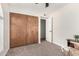 This bedroom features a large closet, neutral walls, and an open door at 2312 W Temple St, Chandler, AZ 85224
