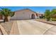 Charming single-story home features a well-manicured front yard, a wide driveway, and an inviting garage at 2312 W Temple St, Chandler, AZ 85224