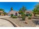 Charming home with desert landscaping and mature trees creates a welcoming curb appeal at 2312 W Temple St, Chandler, AZ 85224