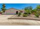 Charming single-story home with an arched entryway and desert landscaping creates a welcoming curb appeal at 2312 W Temple St, Chandler, AZ 85224