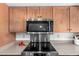 Updated kitchen details highlighting the stainless steel microwave and stovetop at 2312 W Temple St, Chandler, AZ 85224