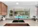 Kitchen sink with a view of the backyard pool at 2312 W Temple St, Chandler, AZ 85224
