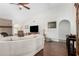 Bright living room with a brick fireplace, plush sofa, and archway entrance at 2312 W Temple St, Chandler, AZ 85224
