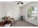 Relaxing living room features an armchair, window, and small bookshelf at 2312 W Temple St, Chandler, AZ 85224