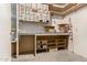Basement workshop area featuring custom shelves, workbench, and plenty of storage at 2437 E North Ln, Phoenix, AZ 85028