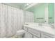 Bathroom with vanity sink and bath tub shower combo at 2437 E North Ln, Phoenix, AZ 85028
