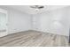 Bedroom with luxury vinyl plank flooring, ceiling fan and wall sconces at 2437 E North Ln, Phoenix, AZ 85028