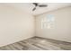 Bright secondary bedroom with luxury vinyl flooring and a ceiling fan at 2437 E North Ln, Phoenix, AZ 85028