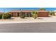 Charming single story home with desert landscaping, including mature cacti and shrubs at 2437 E North Ln, Phoenix, AZ 85028