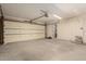 Spacious two-car garage with ample room for vehicles and storage at 2437 E North Ln, Phoenix, AZ 85028