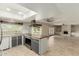 Bright, open kitchen and living area with modern stainless steel appliances and ample counter space at 2437 E North Ln, Phoenix, AZ 85028