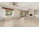 Inviting living room featuring a white brick fireplace and tile flooring, perfect for entertaining at 2437 E North Ln, Phoenix, AZ 85028