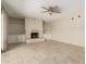 Inviting living room featuring a fireplace with built-in cabinets on either side and tile flooring at 2437 E North Ln, Phoenix, AZ 85028