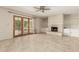 Cozy living room boasts a white brick fireplace, built-in cabinets, and French doors at 2437 E North Ln, Phoenix, AZ 85028