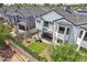 Aerial view of a cozy backyard featuring a patio seating area, artificial grass, and privacy fencing at 2604 N 27Th St # 17, Phoenix, AZ 85008
