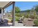 Cozy covered patio featuring comfortable seating, with views of the meticulously landscaped backyard at 2604 N 27Th St # 17, Phoenix, AZ 85008