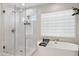 This primary bath features a soaking tub and walk-in shower at 2604 N 27Th St # 17, Phoenix, AZ 85008