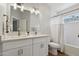 Bathroom with dual vanity sink, modern fixtures, and combination shower/tub at 2604 N 27Th St # 17, Phoenix, AZ 85008