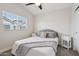 Neutral bedroom with bed and two side tables by a window at 2604 N 27Th St # 17, Phoenix, AZ 85008