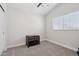 A bedroom with a window and a brown dog crate at 2604 N 27Th St # 17, Phoenix, AZ 85008