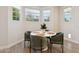 Cozy dining room featuring a white table, green chairs, and natural lighting at 2604 N 27Th St # 17, Phoenix, AZ 85008