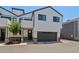 Modern two-story home featuring a gray two-car garage, and neutral color scheme at 2604 N 27Th St # 17, Phoenix, AZ 85008