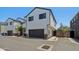 Two-story house features a gray two-car garage, and a brick-lined walkway at 2604 N 27Th St # 17, Phoenix, AZ 85008