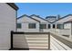 Exterior view showcases sleek townhome architecture with modern design elements, and a spacious balcony at 2604 N 27Th St # 17, Phoenix, AZ 85008