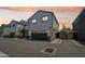 Charming townhome exterior with a gray garage door and meticulous landscaping at 2604 N 27Th St # 17, Phoenix, AZ 85008