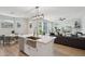 The kitchen flows into the living room and features white cabinets and stainless steel appliances at 2604 N 27Th St # 17, Phoenix, AZ 85008