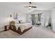 Spacious main bedroom with a ceiling fan, neutral colors and natural light at 2604 N 27Th St # 17, Phoenix, AZ 85008