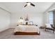 Serene main bedroom featuring carpet, ceiling fan, and stylish decor at 2604 N 27Th St # 17, Phoenix, AZ 85008