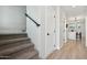 Staircase with carpet and a black handrail leading to the upper level of the home at 2604 N 27Th St # 17, Phoenix, AZ 85008