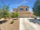 Charming two-story home featuring a well-manicured front yard, neutral tones and a two car garage at 297 W Tamarack Dr, San Tan Valley, AZ 85140