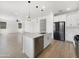 Open-concept kitchen featuring a modern island, stainless steel appliances, and an inviting breakfast bar at 297 W Tamarack Dr, San Tan Valley, AZ 85140