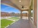 Covered patio overlooking pool and green space, perfect for outdoor relaxation and entertaining at 297 W Tamarack Dr, San Tan Valley, AZ 85140