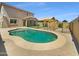 Backyard featuring a refreshing pool, landscaped yard and an area for outdoor entertaining at 297 W Tamarack Dr, San Tan Valley, AZ 85140