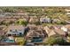 Scenic aerial shot of the property showcasing the pool, patio, solar panels, and neighborhood at 3049 E Longhorn Dr, Gilbert, AZ 85297