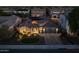 This aerial view highlights a lovely desert home with solar panels, nice landscaping, and a paved driveway at 3049 E Longhorn Dr, Gilbert, AZ 85297