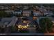 Expansive aerial view showcasing the property's tiled roof, solar panels, landscaped yard, and neighborhood setting at 3049 E Longhorn Dr, Gilbert, AZ 85297