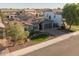 Suburban home with solar panels and a manicured lawn at 3049 E Longhorn Dr, Gilbert, AZ 85297