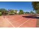 Bright red basketball court on a sunny day with blue sky in residential neighborhood at 3049 E Longhorn Dr, Gilbert, AZ 85297