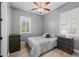 The bedroom has neutral walls, wood-look floors, and a ceiling fan for added comfort at 3049 E Longhorn Dr, Gilbert, AZ 85297