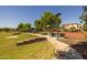 Inviting park area with covered seating and walking paths offers a welcoming space for all residents at 3049 E Longhorn Dr, Gilbert, AZ 85297