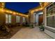Inviting courtyard featuring stylish pavers, a decorative fountain, and ambient string lights, creating a relaxing outdoor space at 3049 E Longhorn Dr, Gilbert, AZ 85297