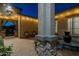 Outdoor patio featuring ambient lighting and elegant potted plants at 3049 E Longhorn Dr, Gilbert, AZ 85297