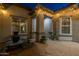 Charming courtyard featuring a fountain, brick pavers, and ambient string lights for evening enjoyment at 3049 E Longhorn Dr, Gilbert, AZ 85297