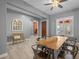 Bright dining room featuring wood-look tile flooring and neutral wall colors at 3049 E Longhorn Dr, Gilbert, AZ 85297
