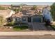 Charming home featuring stone veneer, a well-manicured front yard, and solar panels, perfect for energy-efficient living at 3049 E Longhorn Dr, Gilbert, AZ 85297
